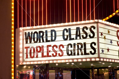 ist2_605607-topless-girls-sign-outside-strip-club.jpg