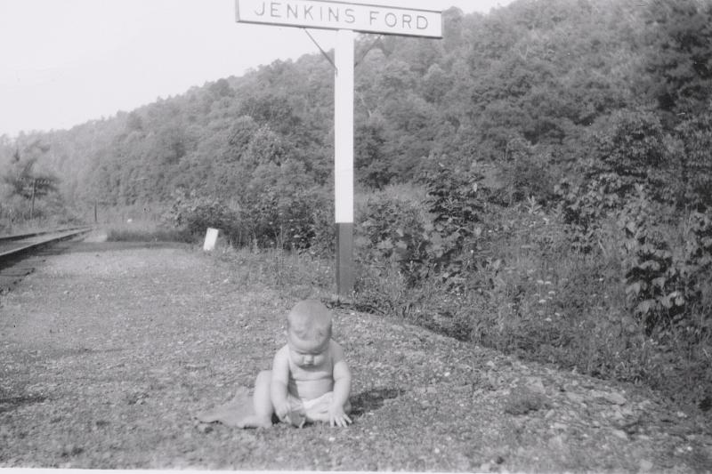 Mom baby at Jenkins Ford sign.jpg